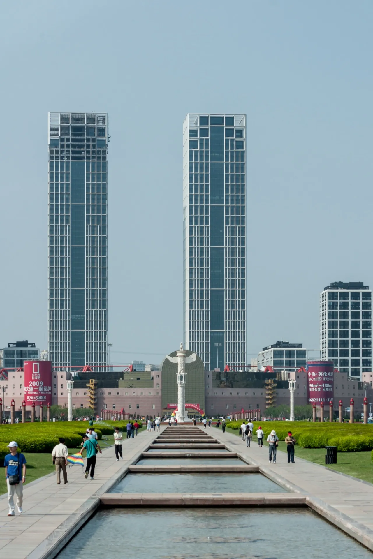 Xinghai Square in Dalian, a vast plaza with a long reflecting pool leading to twin skyscrapers